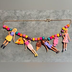 Necklace of Small Dolls with Charms
